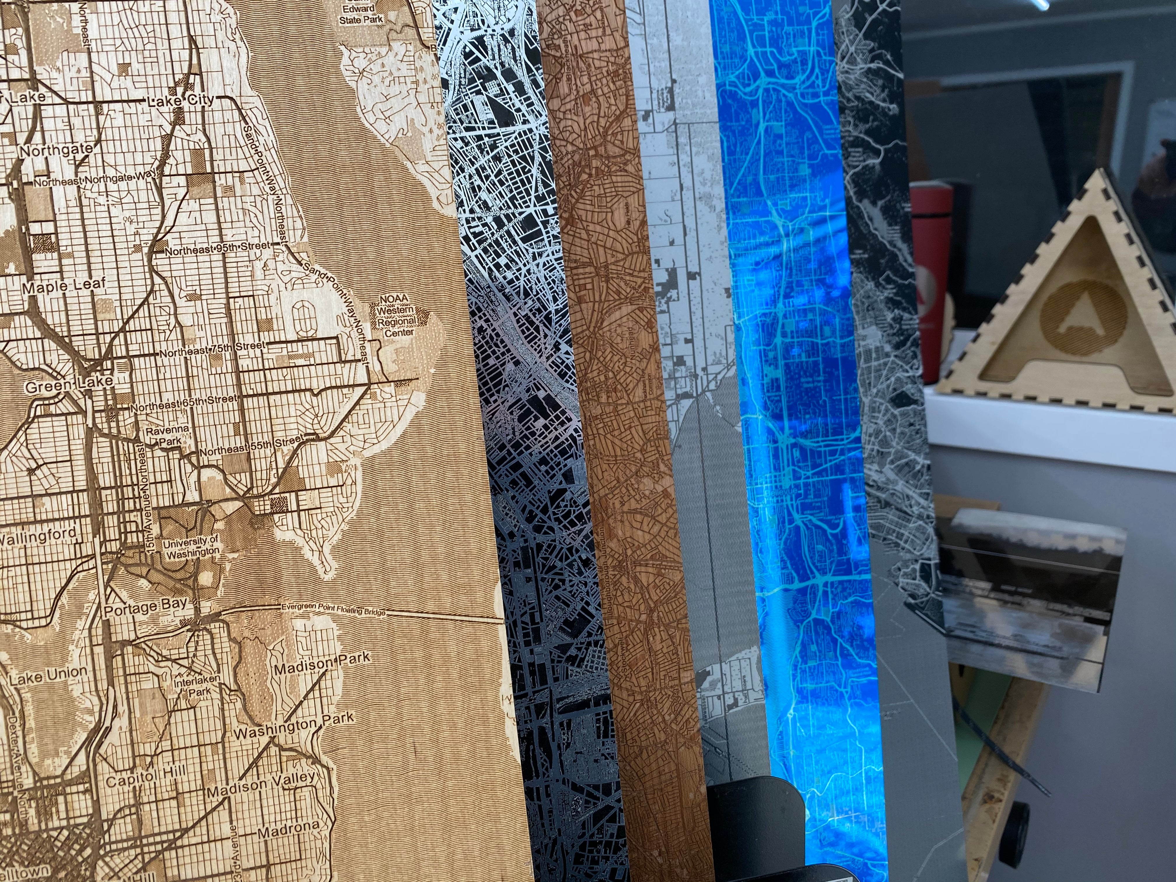 Cartographic map design on wood, metal, anodized aluminum 