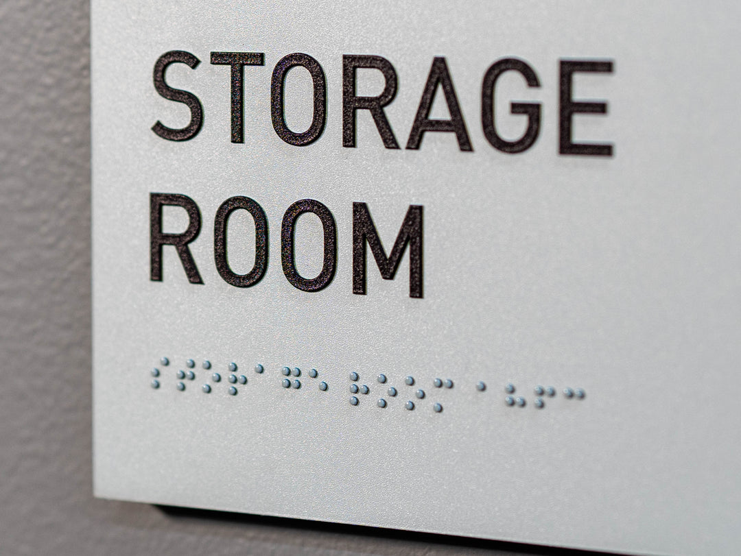 Custom edge painted interior sign with raised letters and ADA compliant Braille.