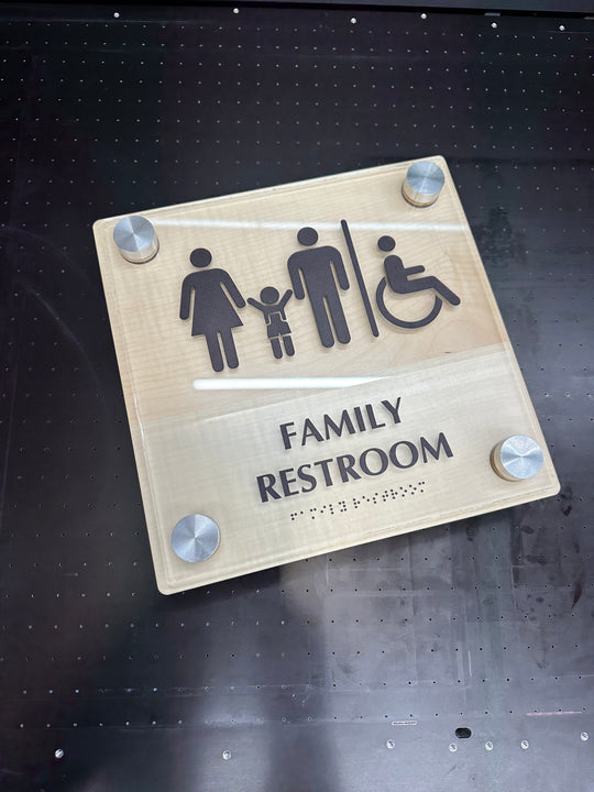Custom raised transparent interior sign with raised letters and ADA compliant Braille.